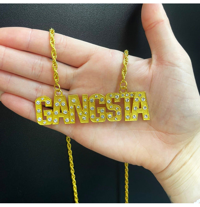 Kullanvärinen riipus timangeilla Gangsta